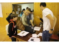 Prezent�cia ��astn�kov s��a�e pri vstupe do telocvi�ne
