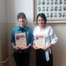 Ocenen dievat: E. Lacov a K. Komrov s diplomami